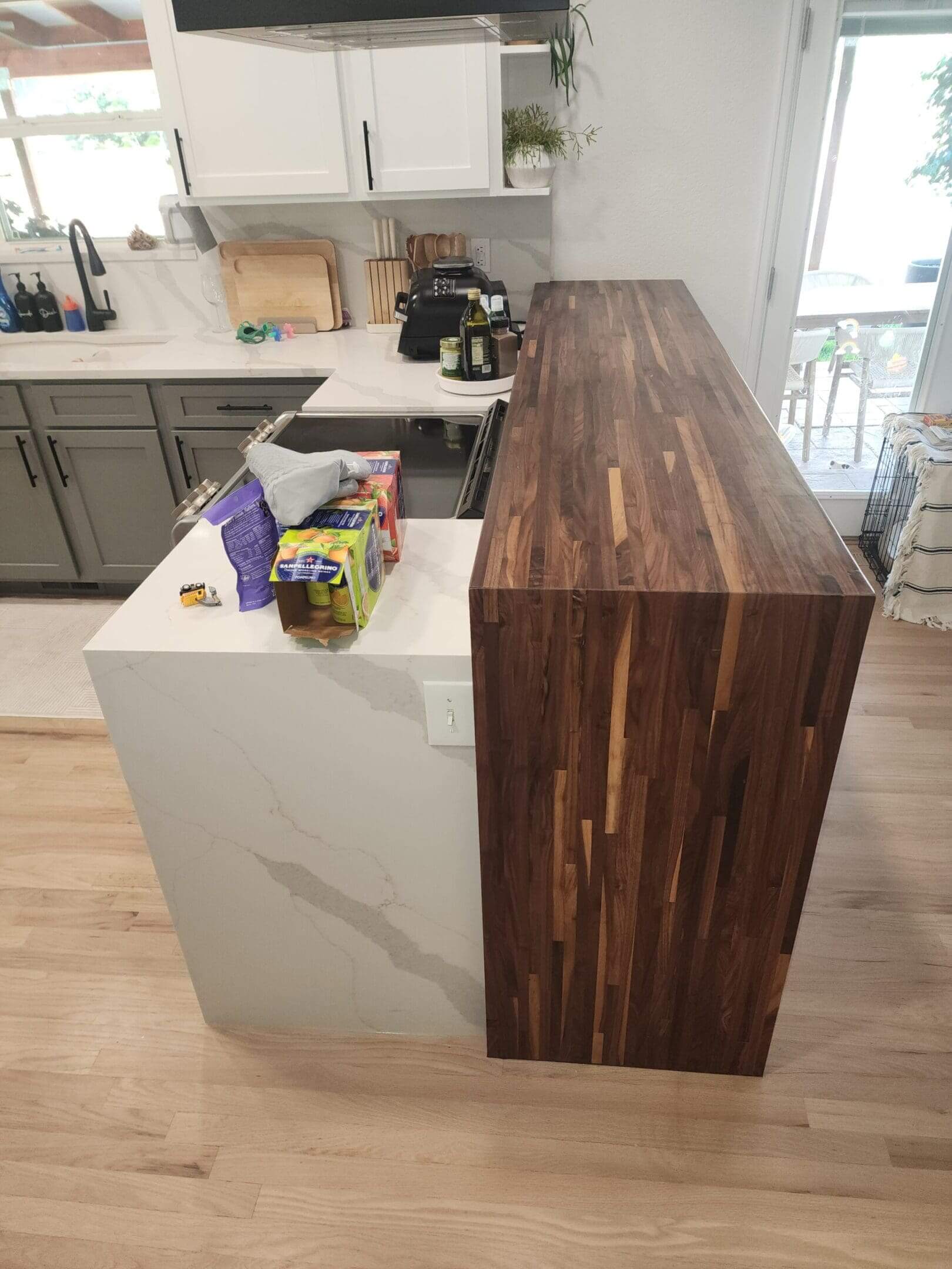 Kitchen counter with snacks and wooden surface.