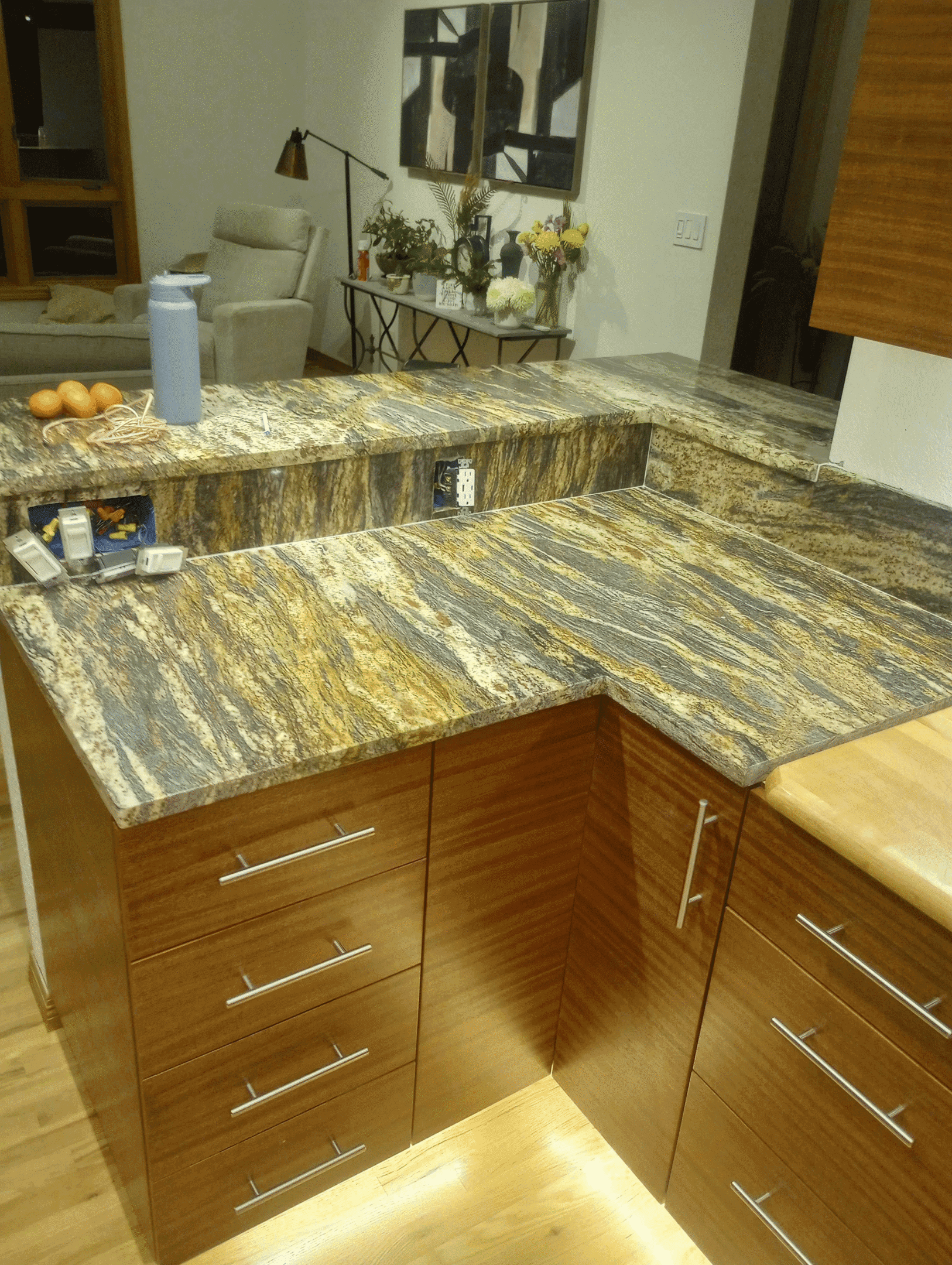 Modern kitchen with granite countertops and cabinets.