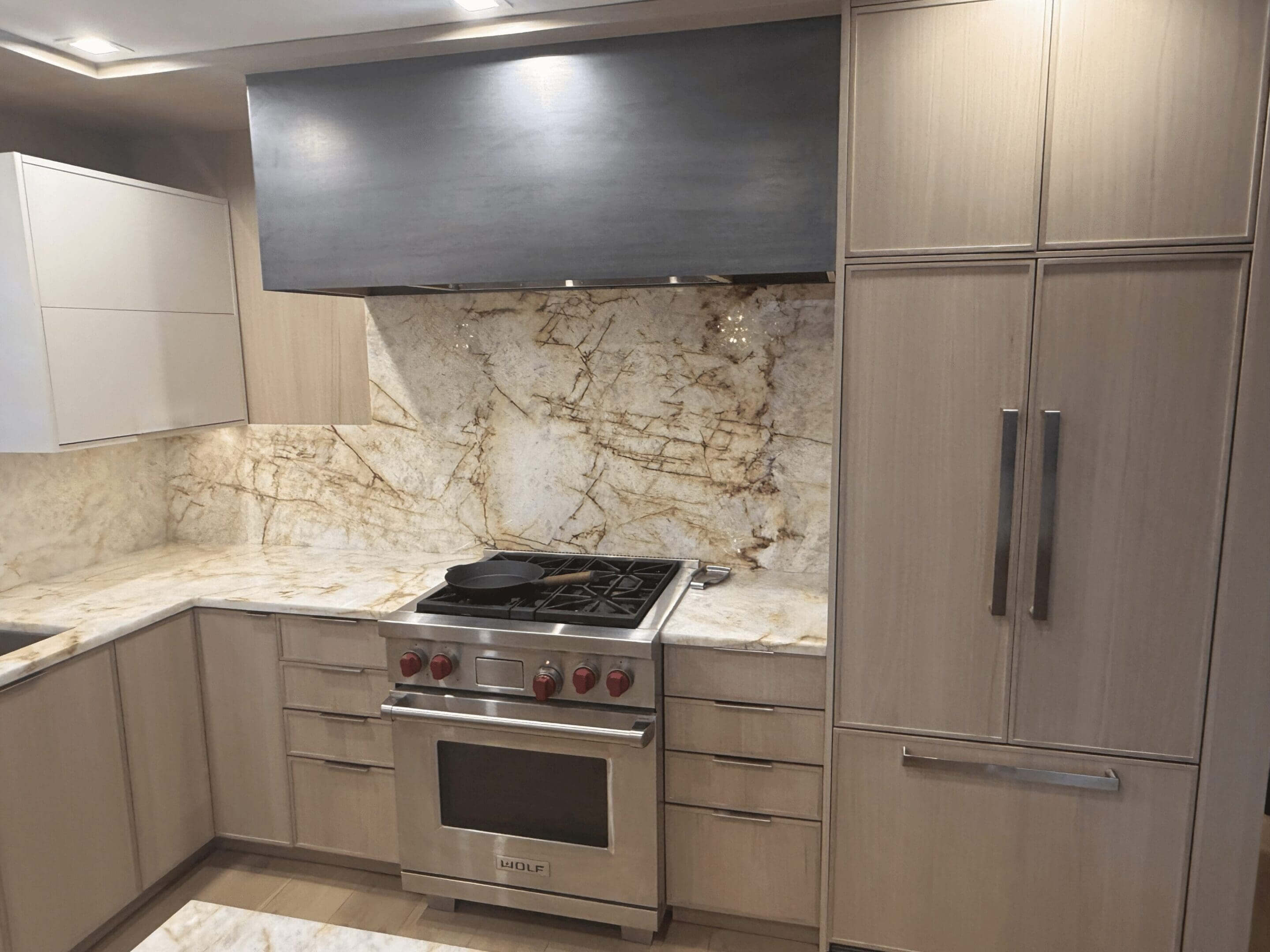 Modern kitchen with stainless steel appliances.